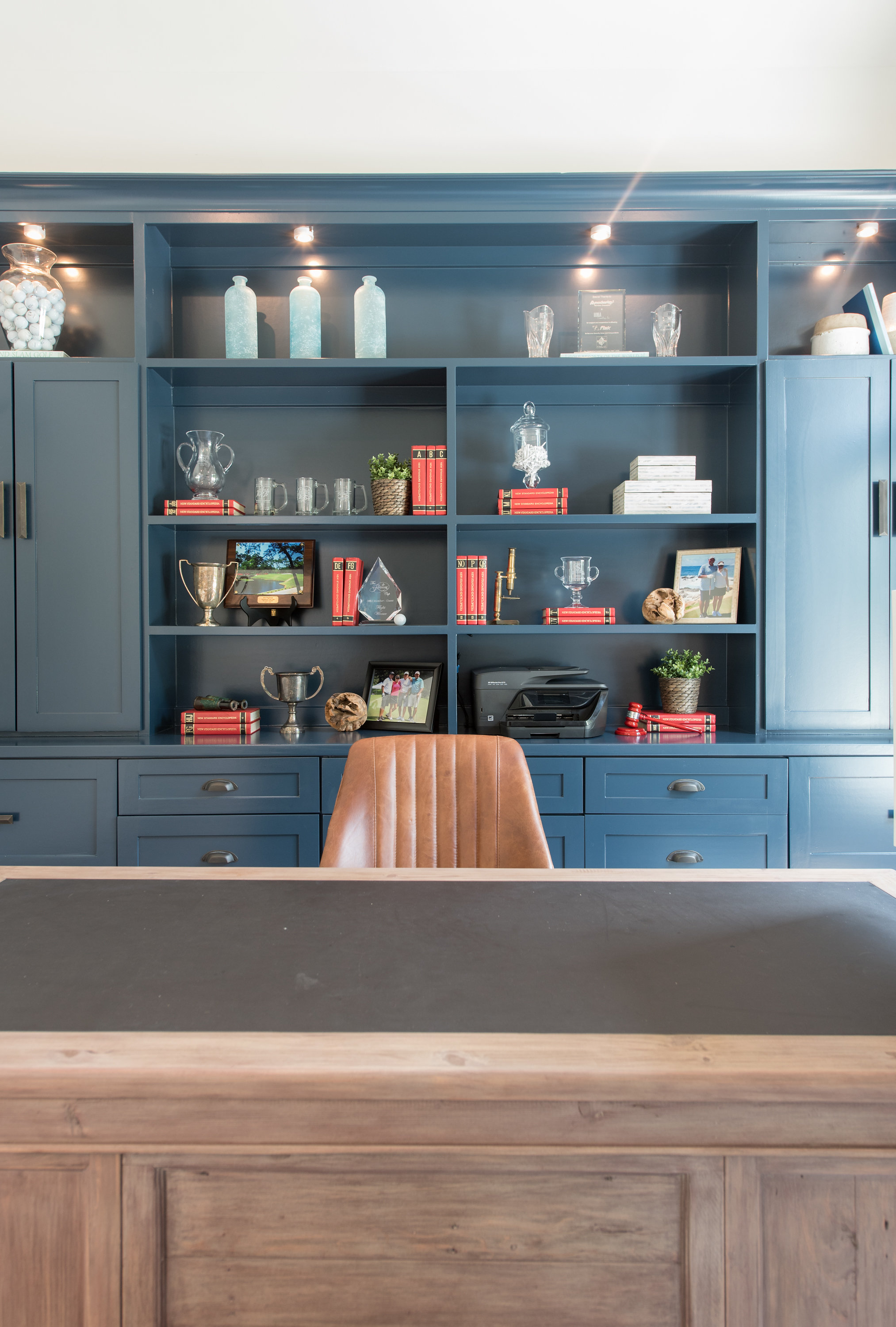 Modern kitchen with white cabinets and gold hardware