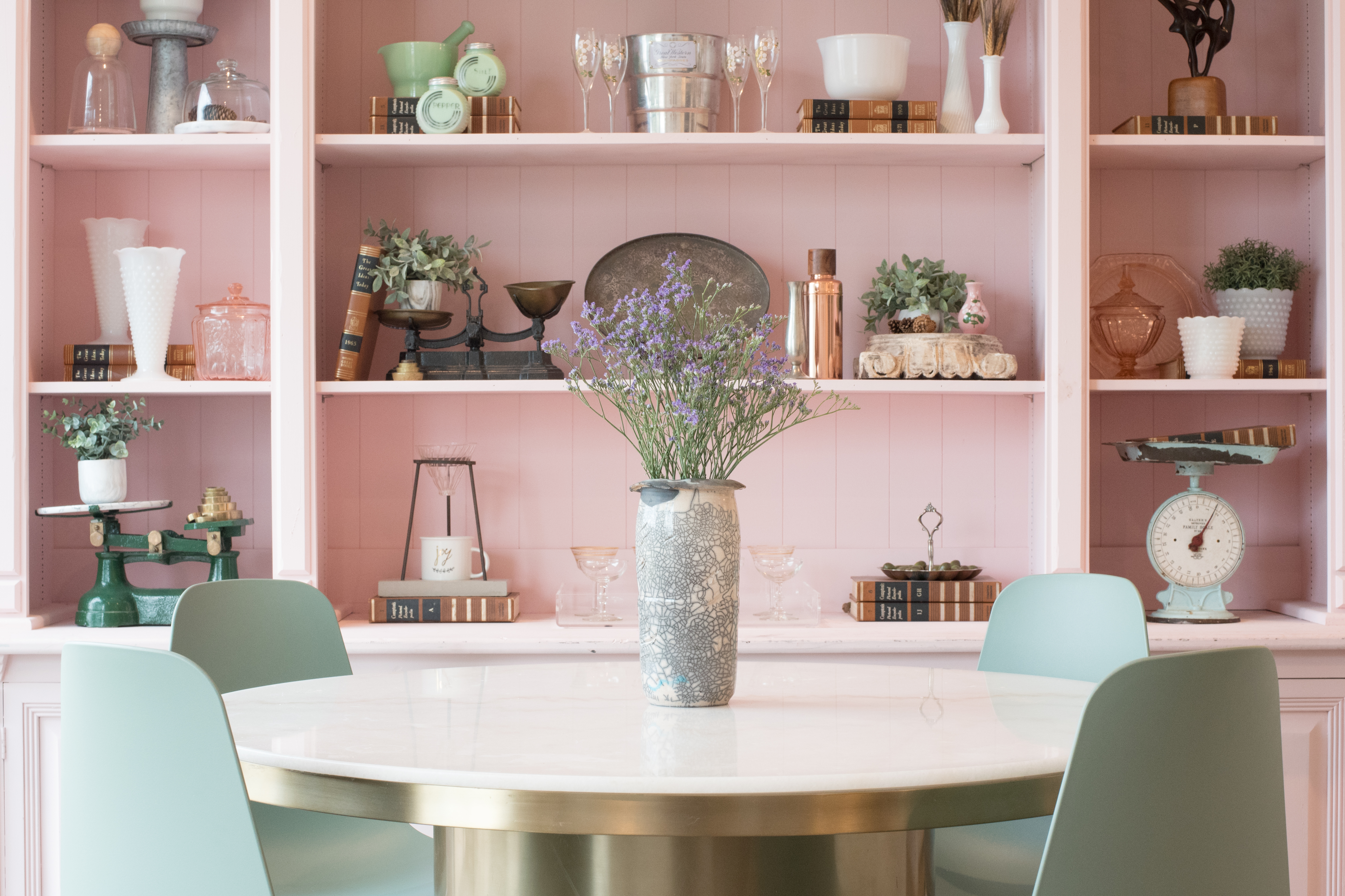 Styled dining table with flowers and vintage accents